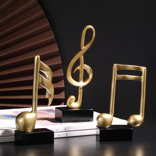 Adorno Notas musicales dorado