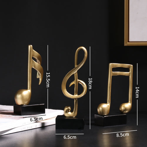 Adorno Notas musicales dorado