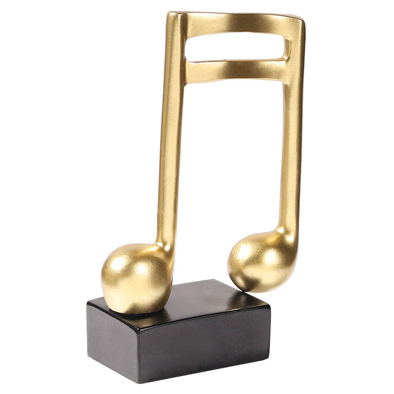 Adorno Notas musicales dorado