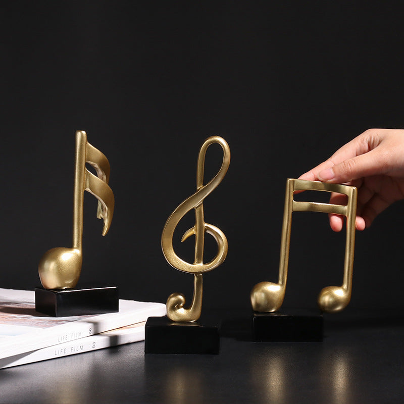 Adorno Notas musicales dorado